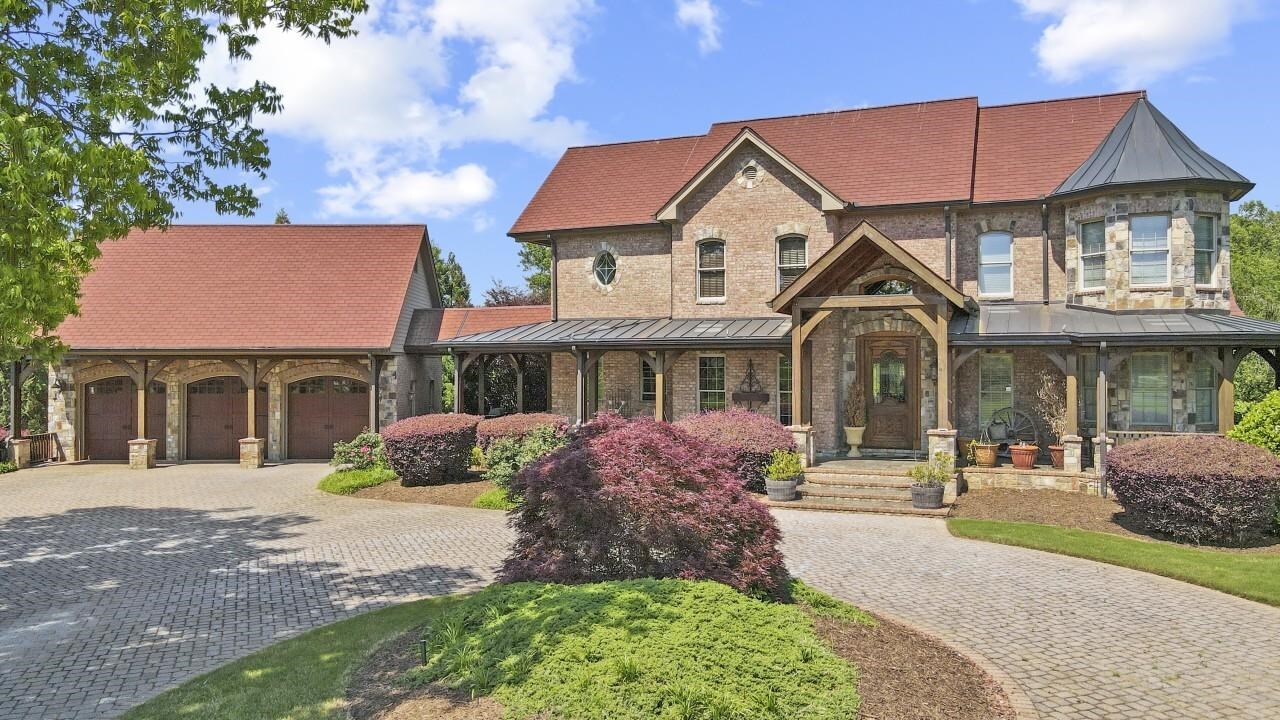 3350 Tanners Mill Road Gainesville, GA 30507 - Photo 1 of 1 a front view of a house with a garden