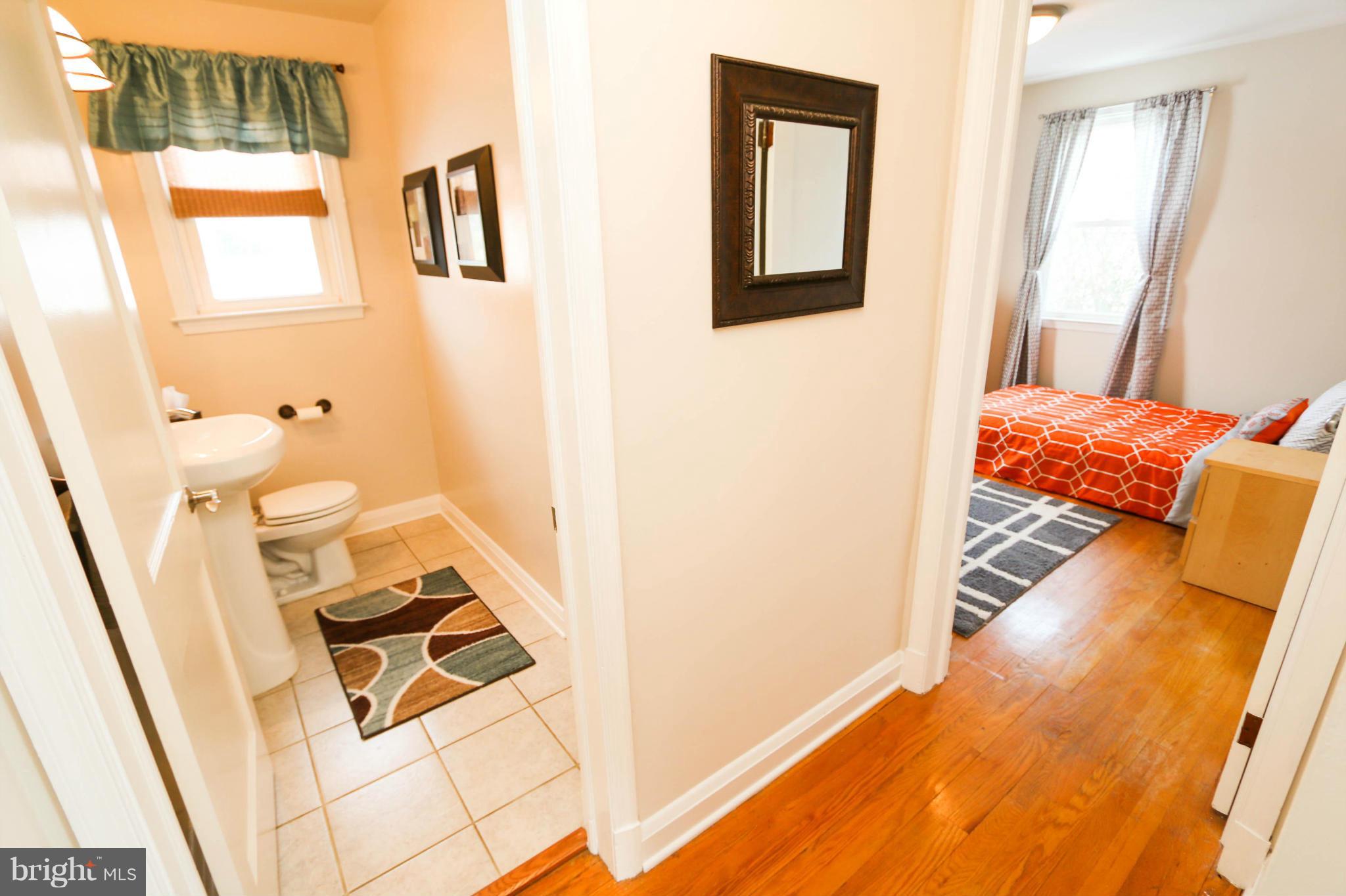 4228 East Joppa Road Baltimore, MD 21236 - Photo 14 of 28 a bedroom with a bed and a window