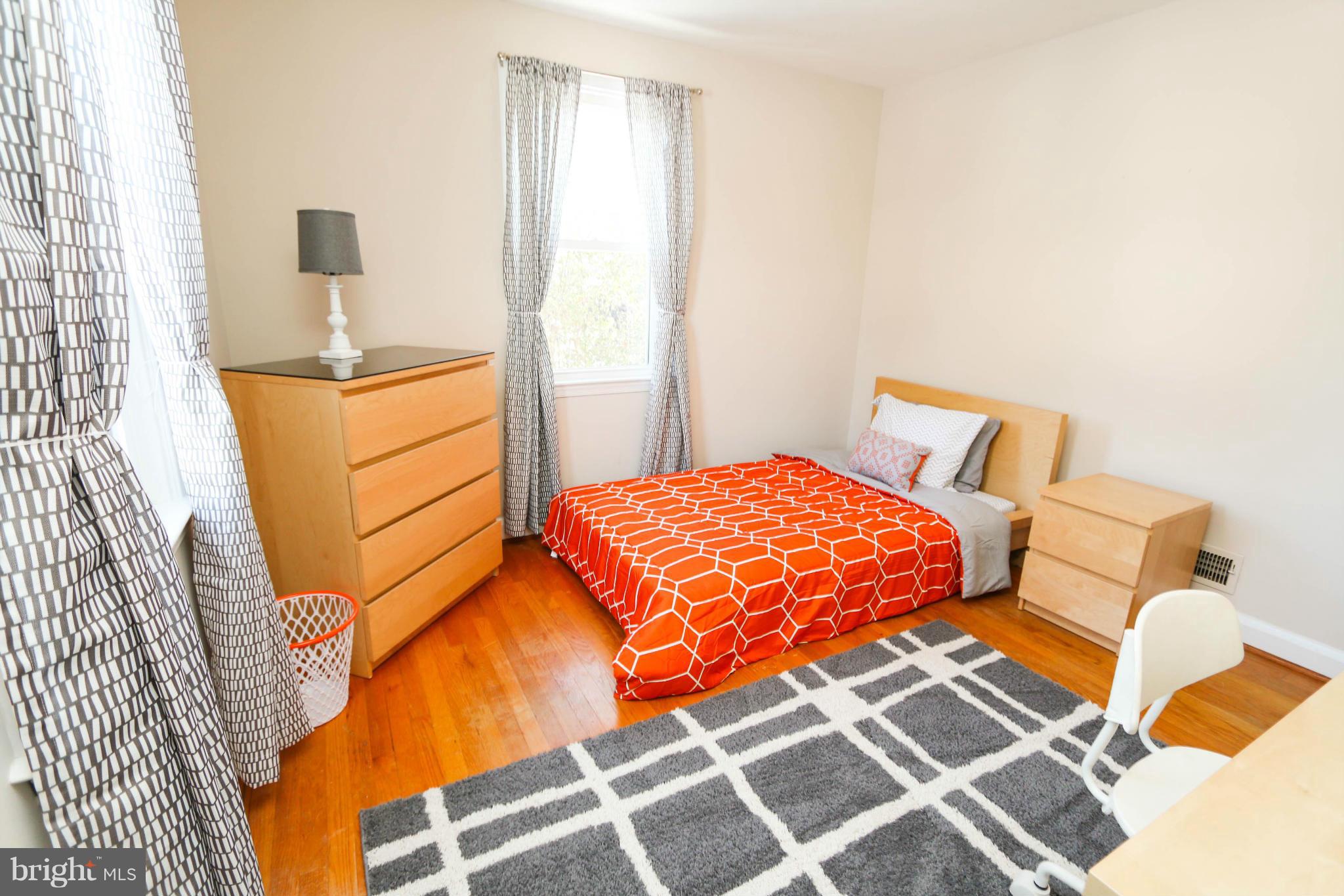 4228 East Joppa Road Baltimore, MD 21236 - Photo 17 of 28 a bedroom with a bed and a window
