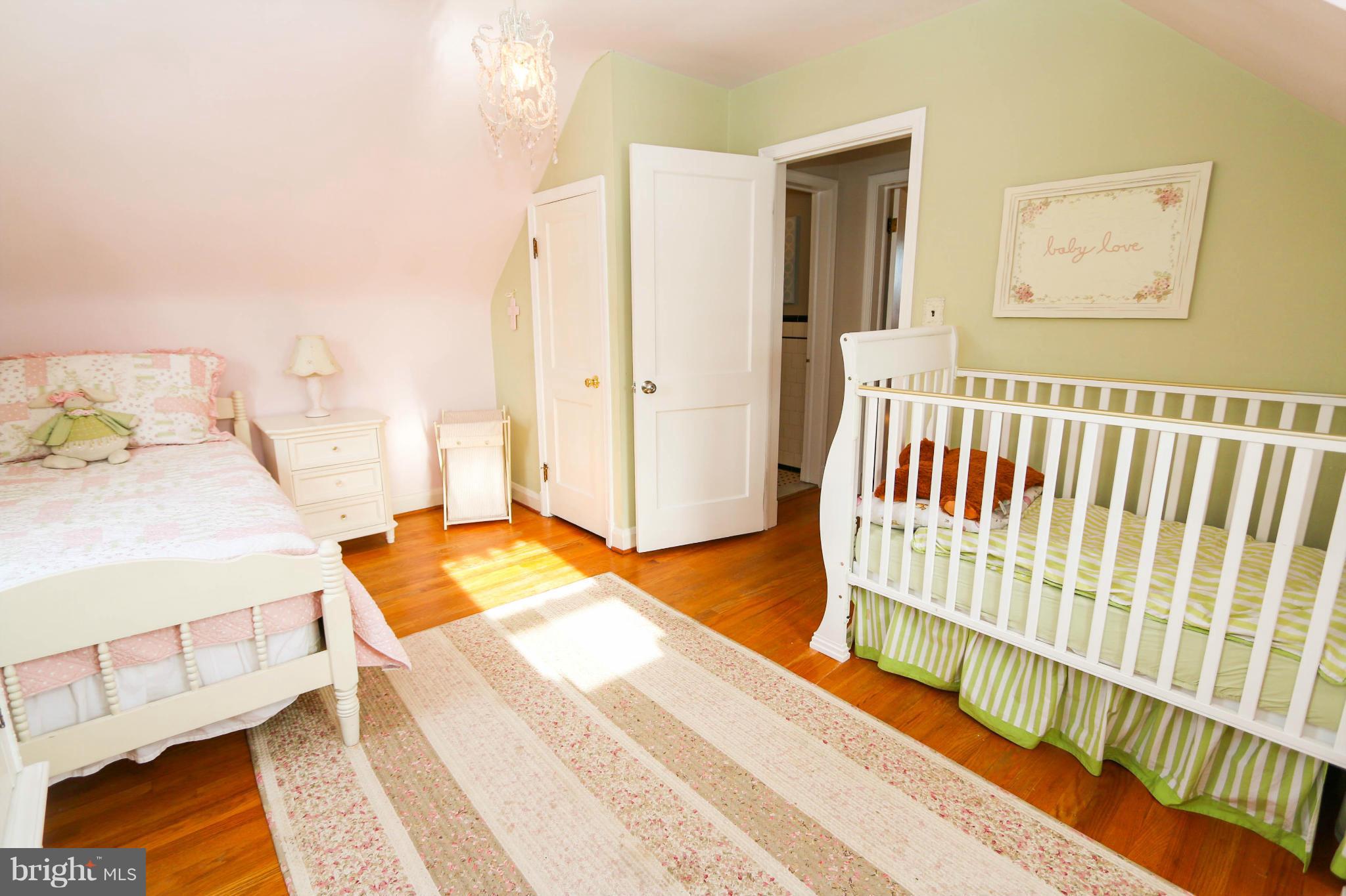 4228 East Joppa Road Baltimore, MD 21236 - Photo 18 of 28 a bedroom with a bed and wooden floor