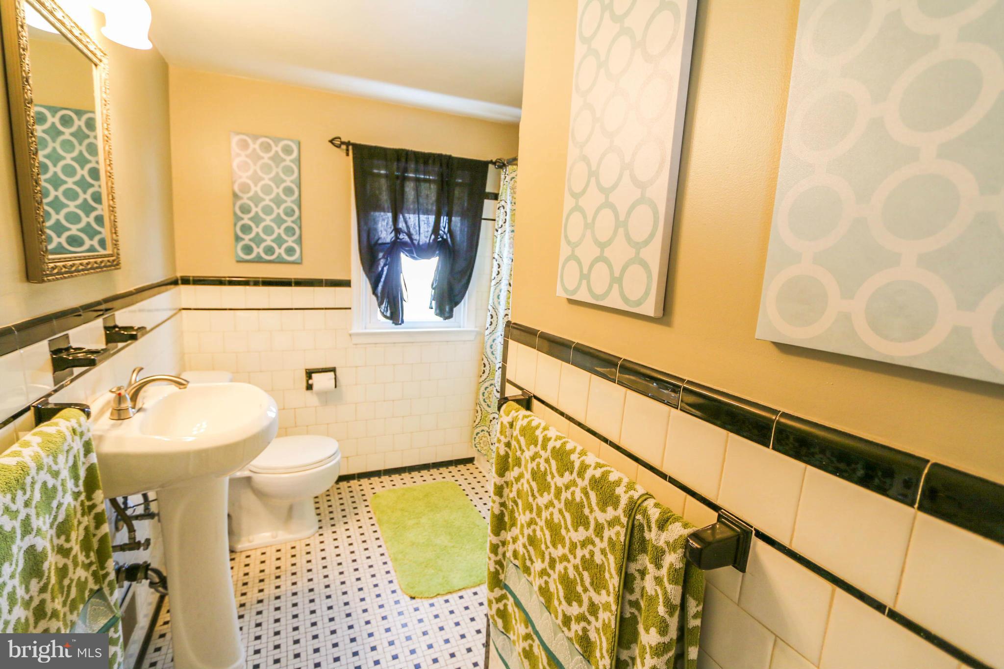 4228 East Joppa Road Baltimore, MD 21236 - Photo 20 of 28 a bathroom with a sink and a mirror