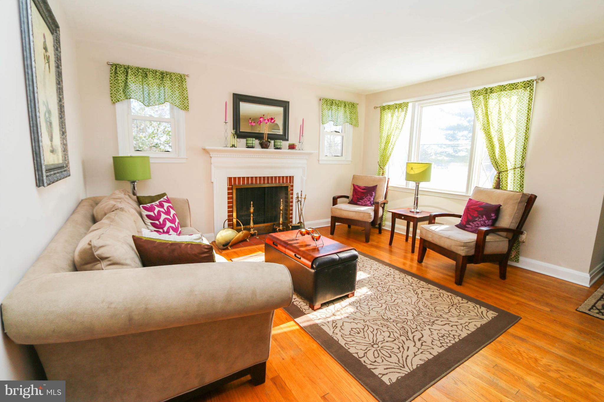 4228 East Joppa Road Baltimore, MD 21236 - Photo 3 of 28 a living room with furniture and a fireplace