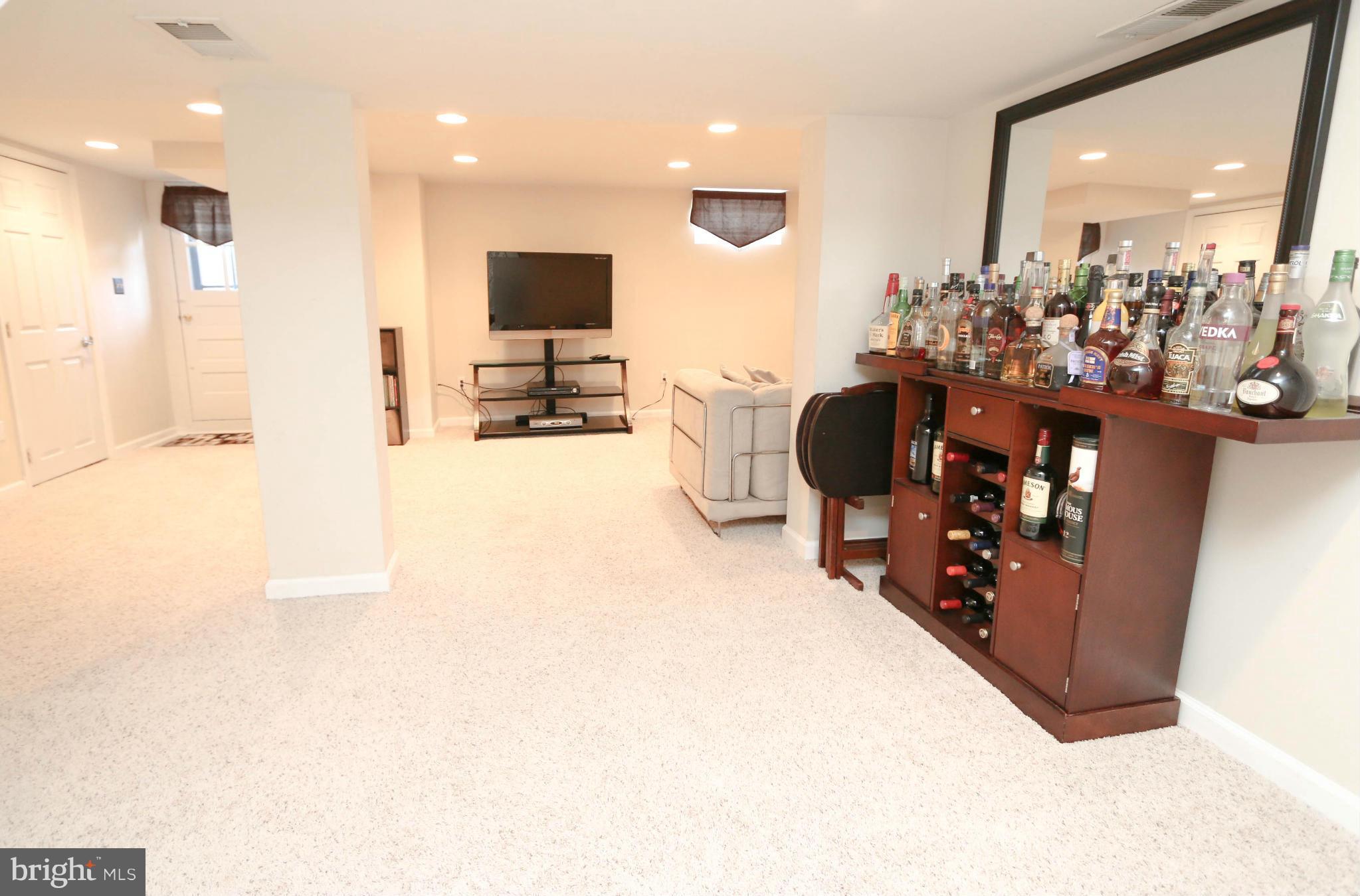 4228 East Joppa Road Baltimore, MD 21236 - Photo 23 of 28 a living room with furniture and a flat screen tv