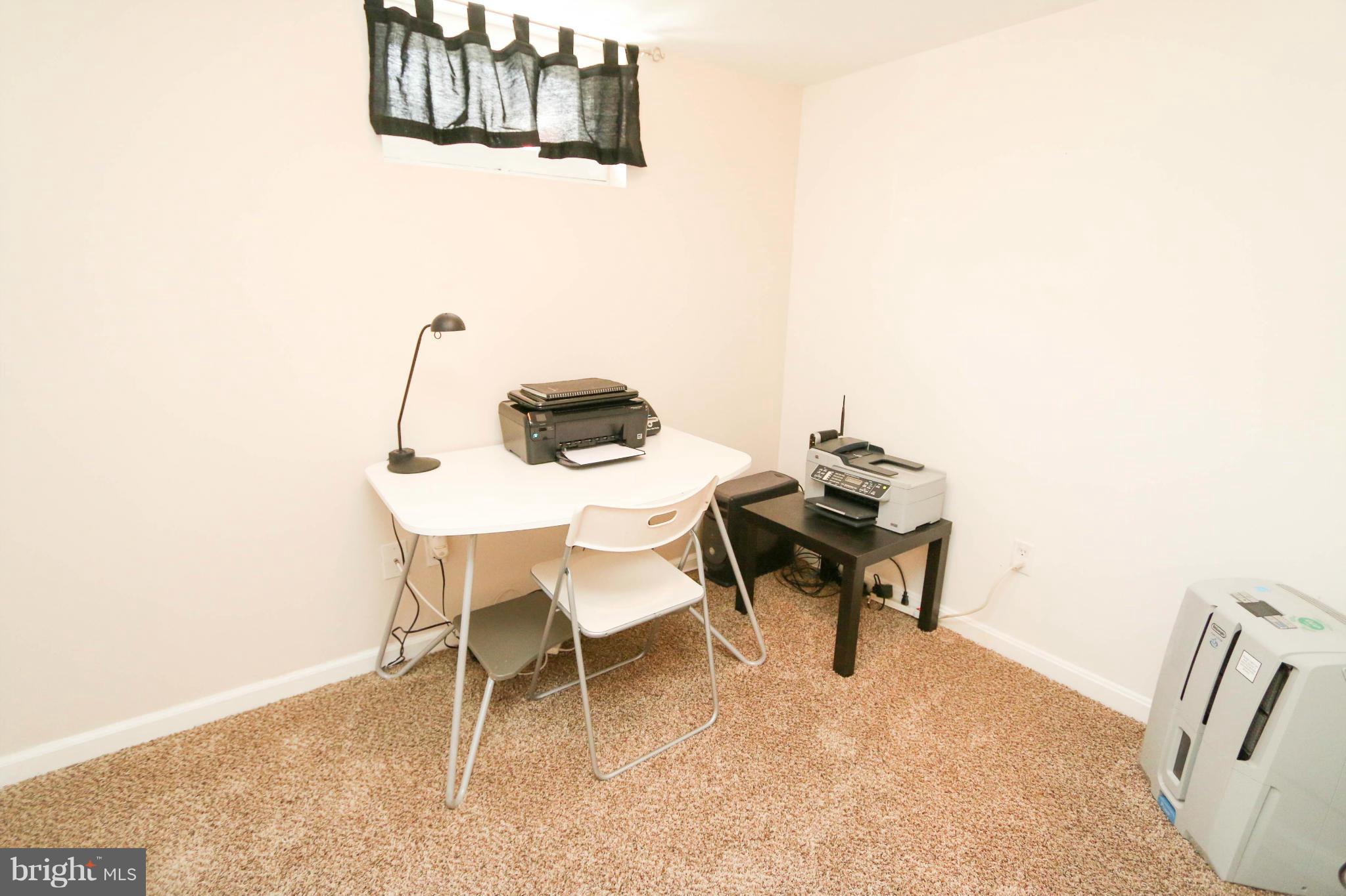 4228 East Joppa Road Baltimore, MD 21236 - Photo 24 of 28 a dining room with furniture and a wooden floor