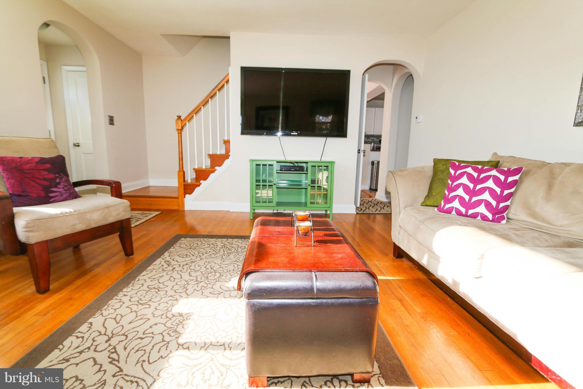 4228 East Joppa Road Baltimore, MD 21236 - Photo 4 of 28 a living room with furniture and a flat screen tv
