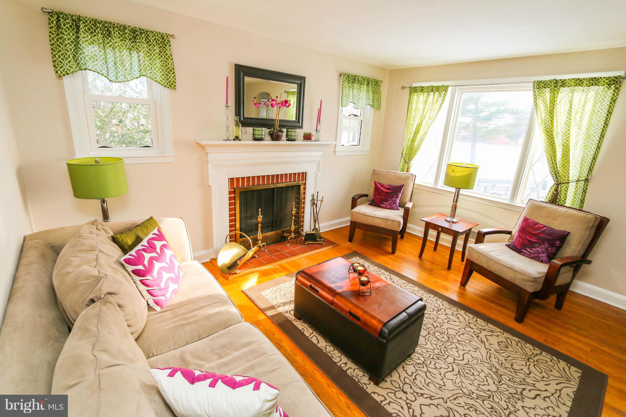 4228 East Joppa Road Baltimore, MD 21236 - Photo 5 of 28 a living room with furniture and a fireplace