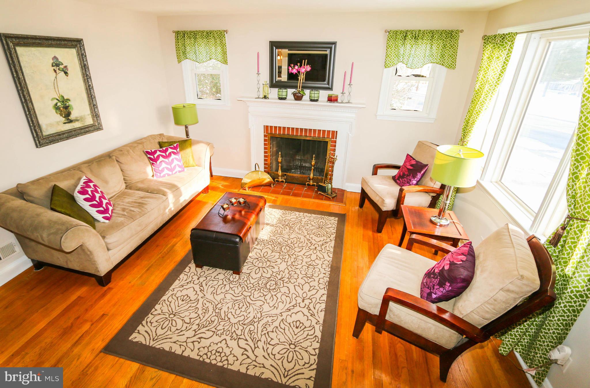 4228 East Joppa Road Baltimore, MD 21236 - Photo 6 of 28 a living room with furniture and a fireplace