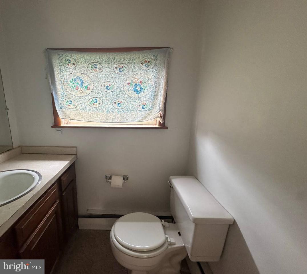 837 Francis Scott Key Highway Keymar, MD 21757 - Photo 16 of 25 a white toilet sitting next to a bathroom sink