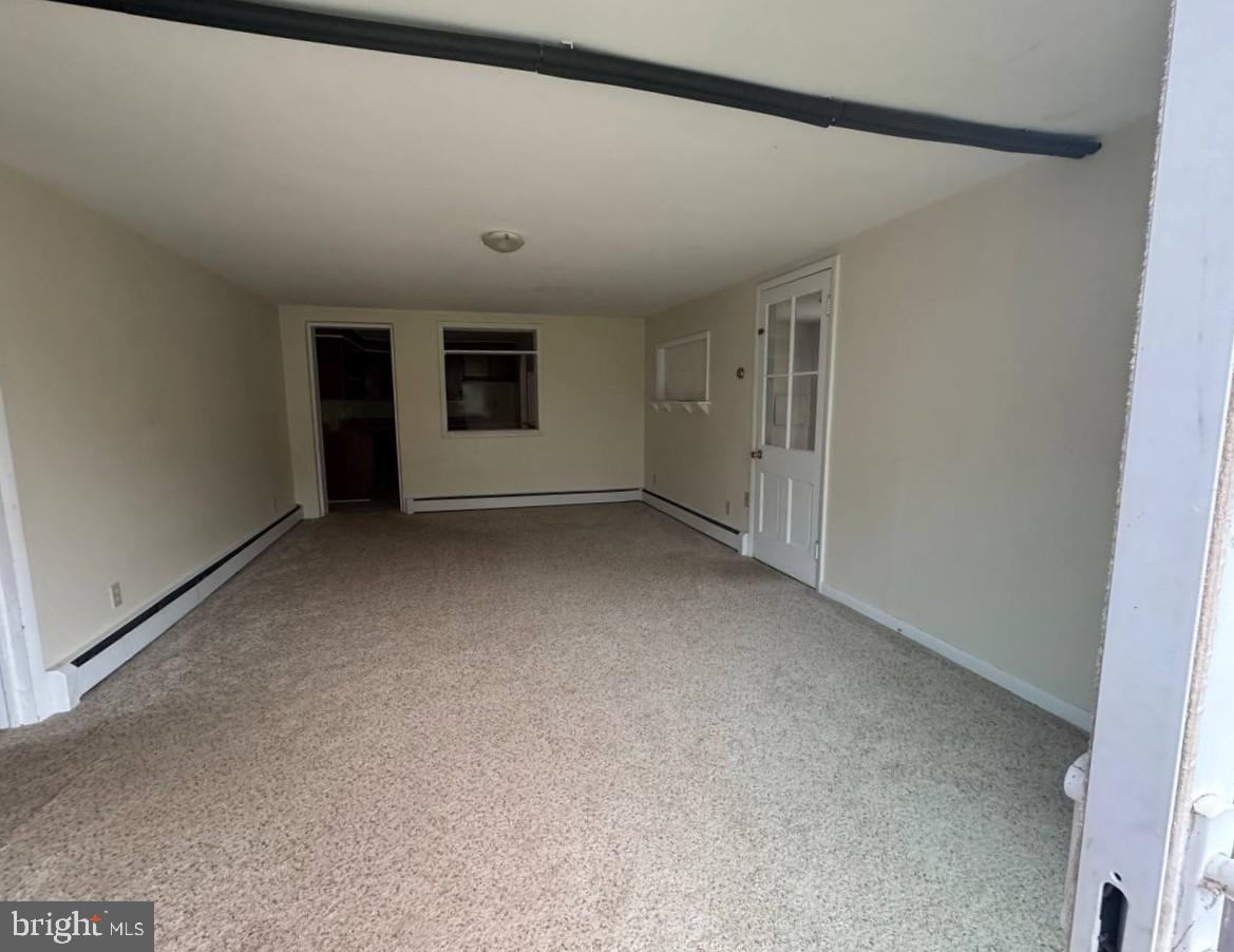 837 Francis Scott Key Highway Keymar, MD 21757 - Photo 3 of 25 a view of a livingroom with an empty space and a fireplace