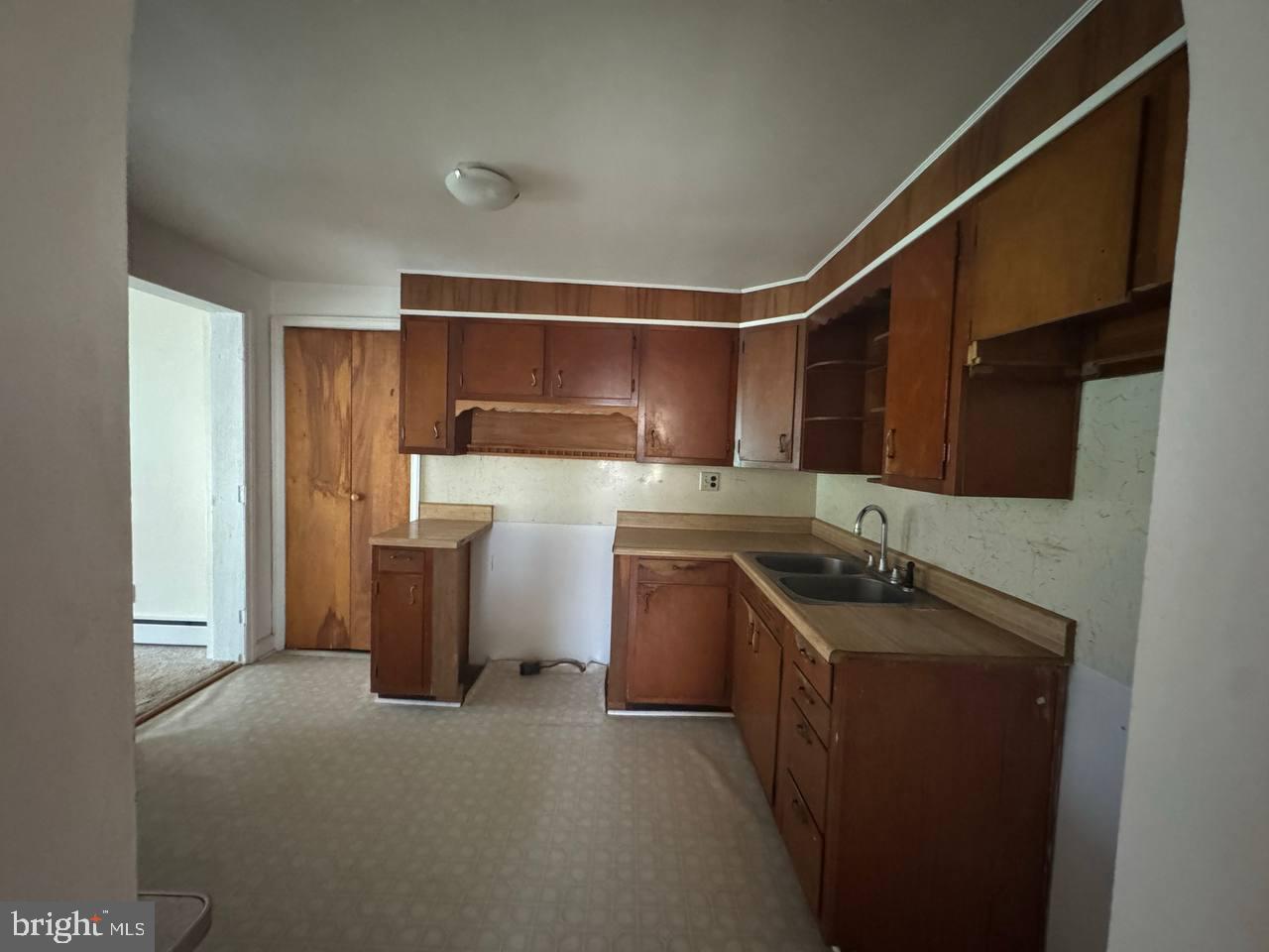 837 Francis Scott Key Highway Keymar, MD 21757 - Photo 6 of 25 a kitchen with sink cabinets and stove top oven