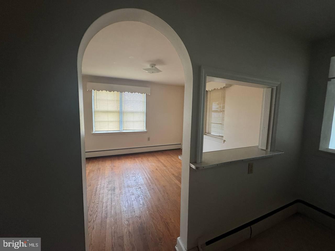 837 Francis Scott Key Highway Keymar, MD 21757 - Photo 8 of 25 an empty room with wooden floor and windows