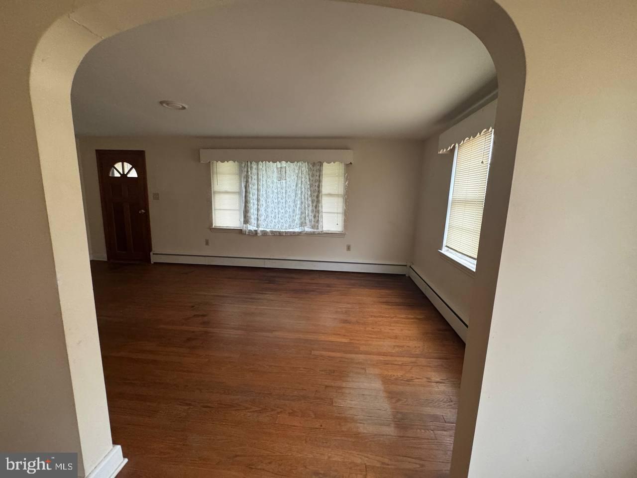 837 Francis Scott Key Highway Keymar, MD 21757 - Photo 9 of 25 an empty room with wooden floor and windows