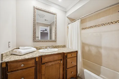 a bathroom with a granite countertop sink mirror and double