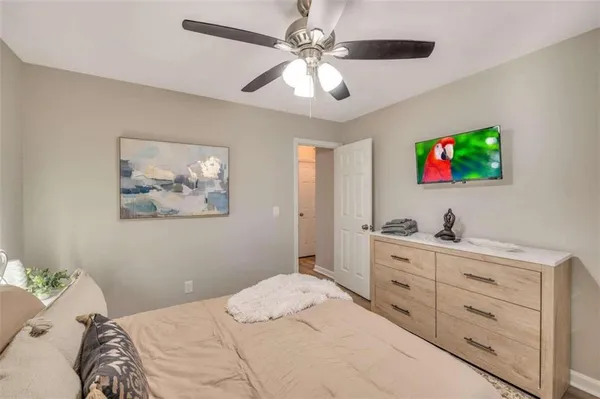 a bedroom with a bed and a bookshelf