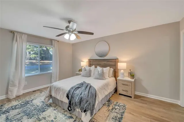 a bedroom with a bed and a window