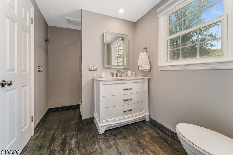 14 Lexington Road Annandale, NJ 08801 - Photo 33 of 47 a bathroom with a sink a toilet and a window
