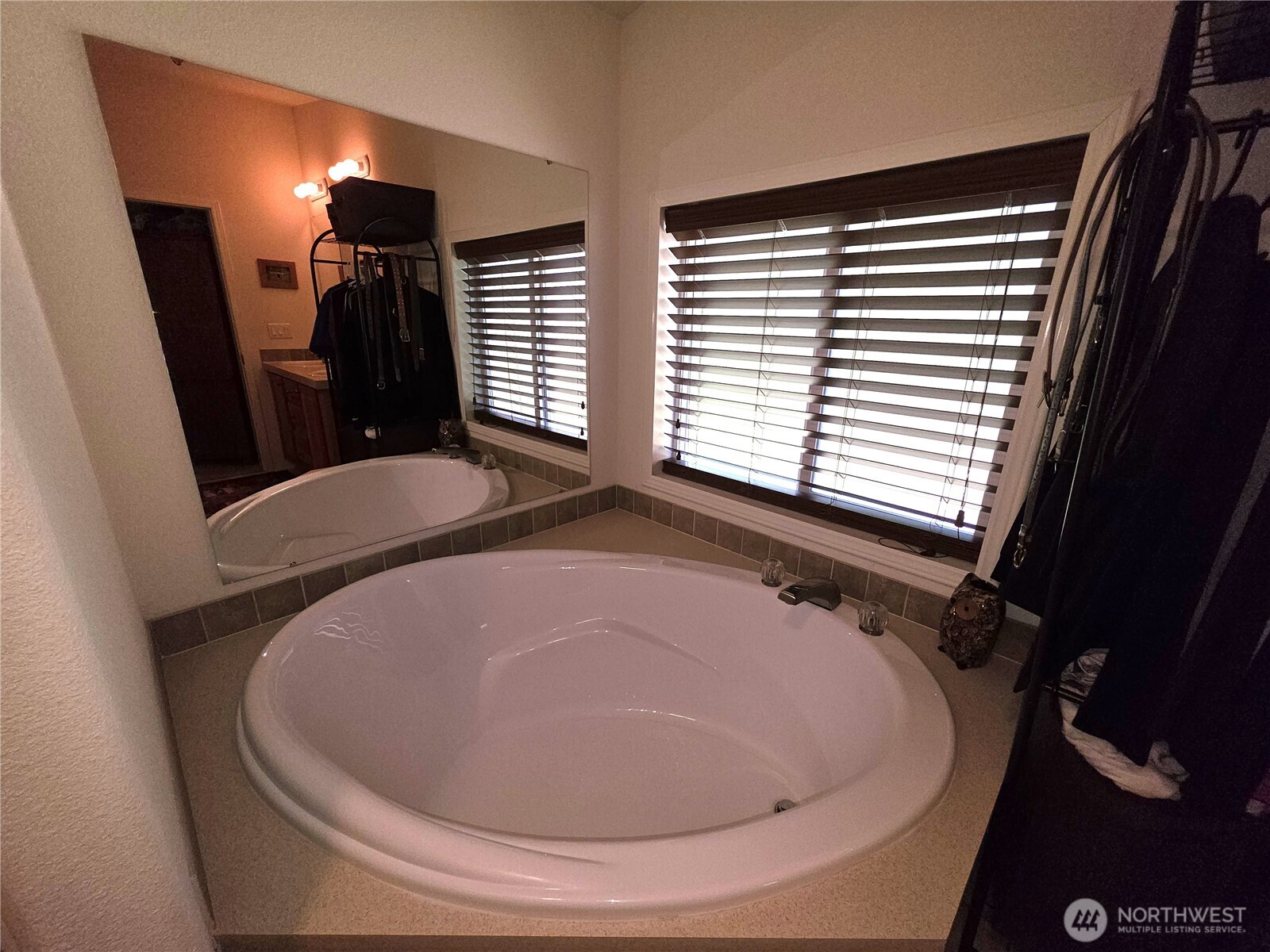393 Summer Road Tonasket, WA 98855 - Photo 11 of 37 a bathroom with a sink and mirror