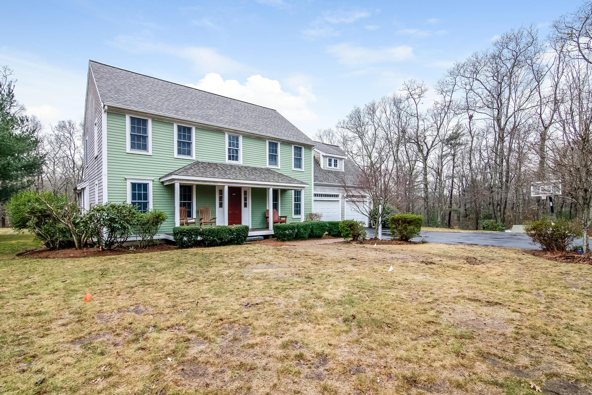 a front view of a house with yard patio and outdoor seating