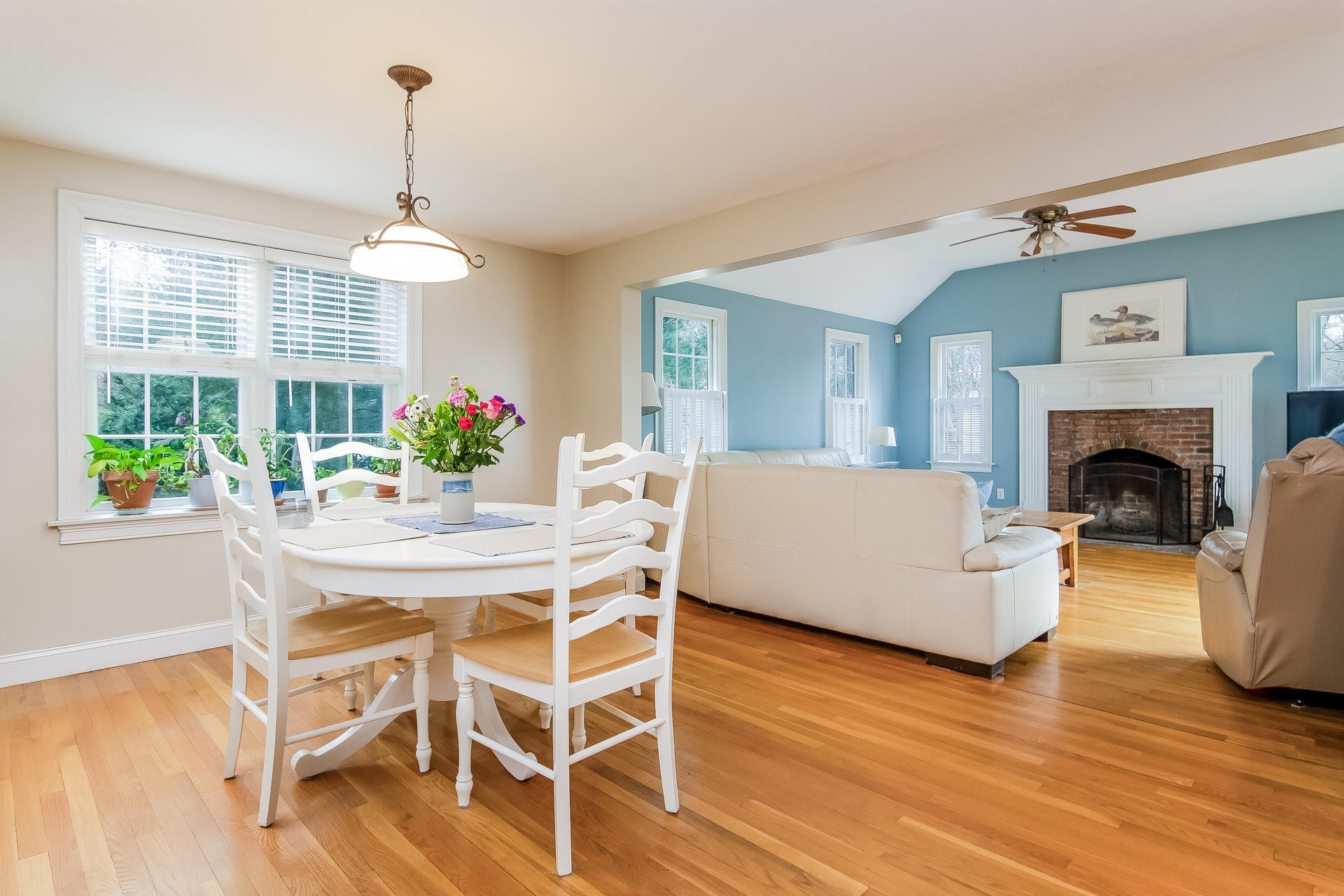 40 Chipman Road Sandwich, MA 02563 - Photo 14 of 26 a living room with furniture dining table and a fireplace