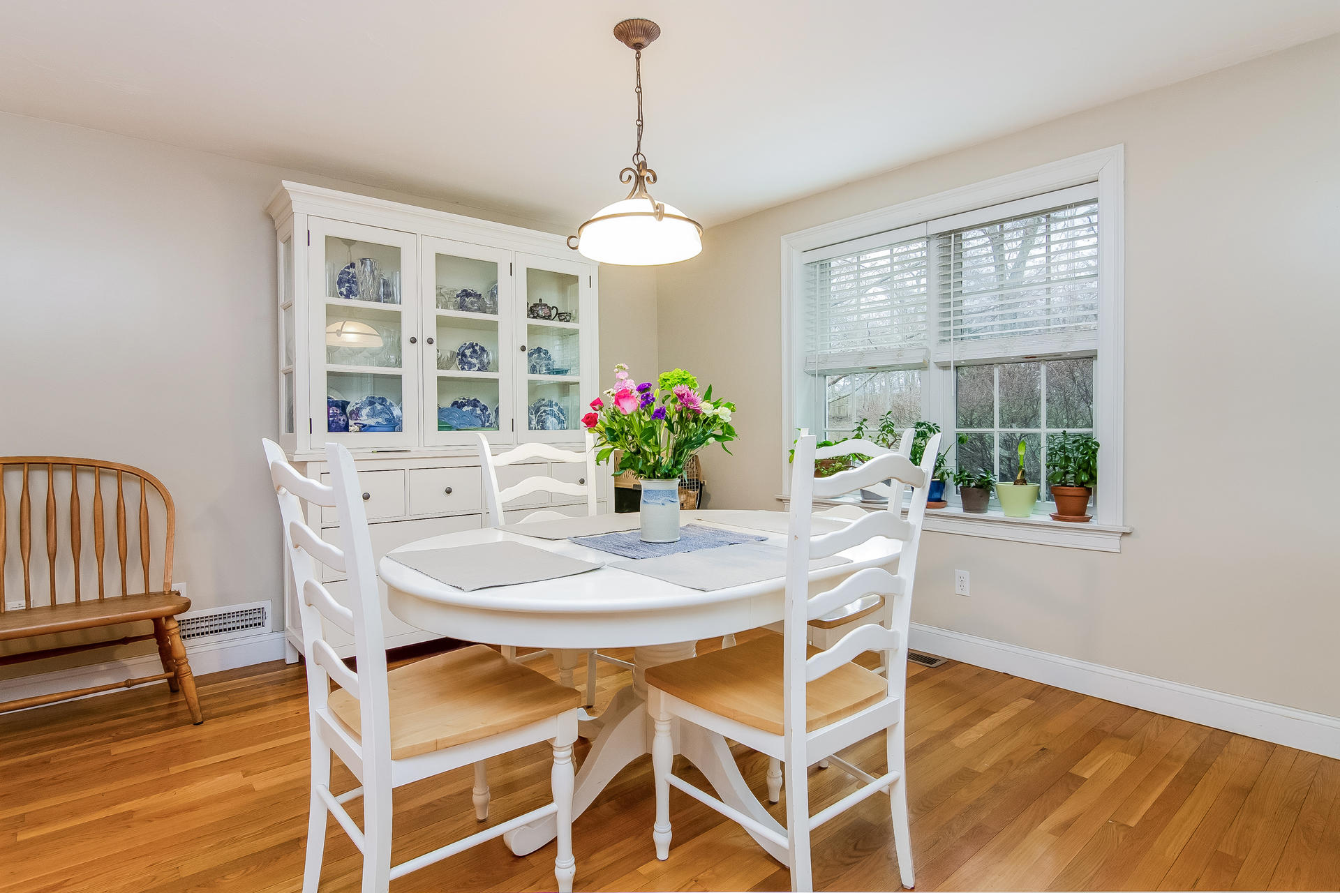 40 Chipman Road Sandwich, MA 02563 - Photo 9 of 26 a dining room with furniture a chandelier and wooden floor