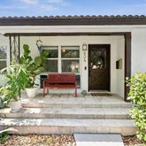 a view of entrance with potted plants and wooden floor