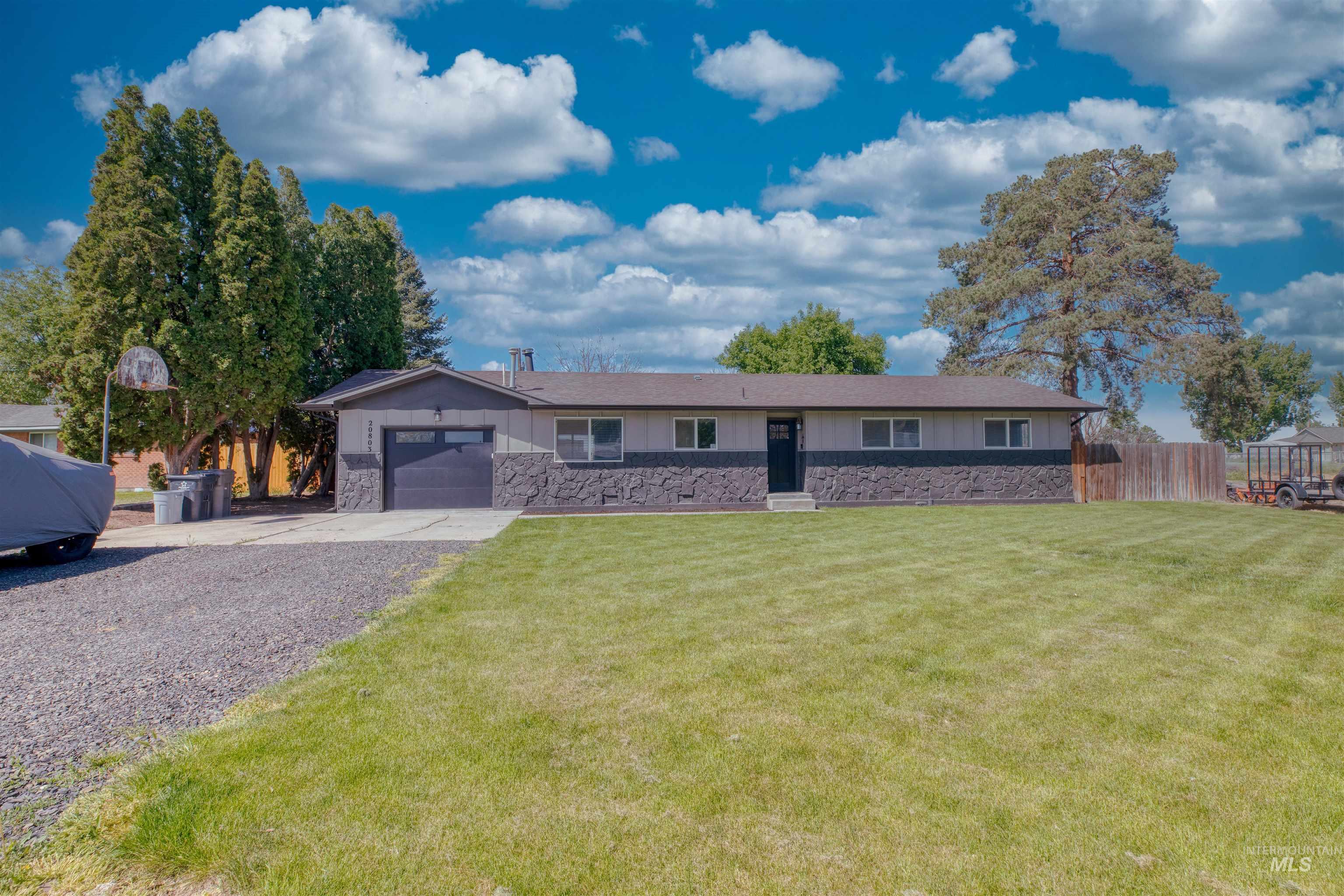 20803 Friends Road Greenleaf, ID 83626 - Photo 28 of 39 Ranch-style residence featuring a stone veneer facade and a spacious front lawn