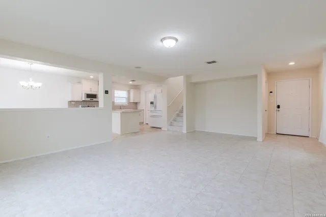 a view of a kitchen with a sink and cabinets