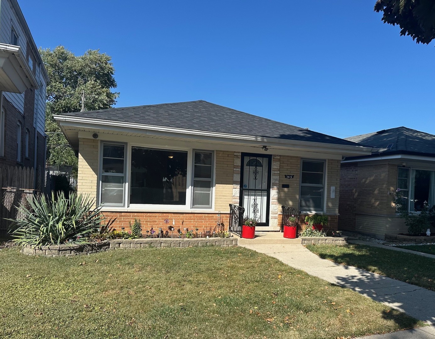 3826 West 83rd Street Chicago, IL 60652 - Photo 1 of 14 a front view of a house with a yard and garage