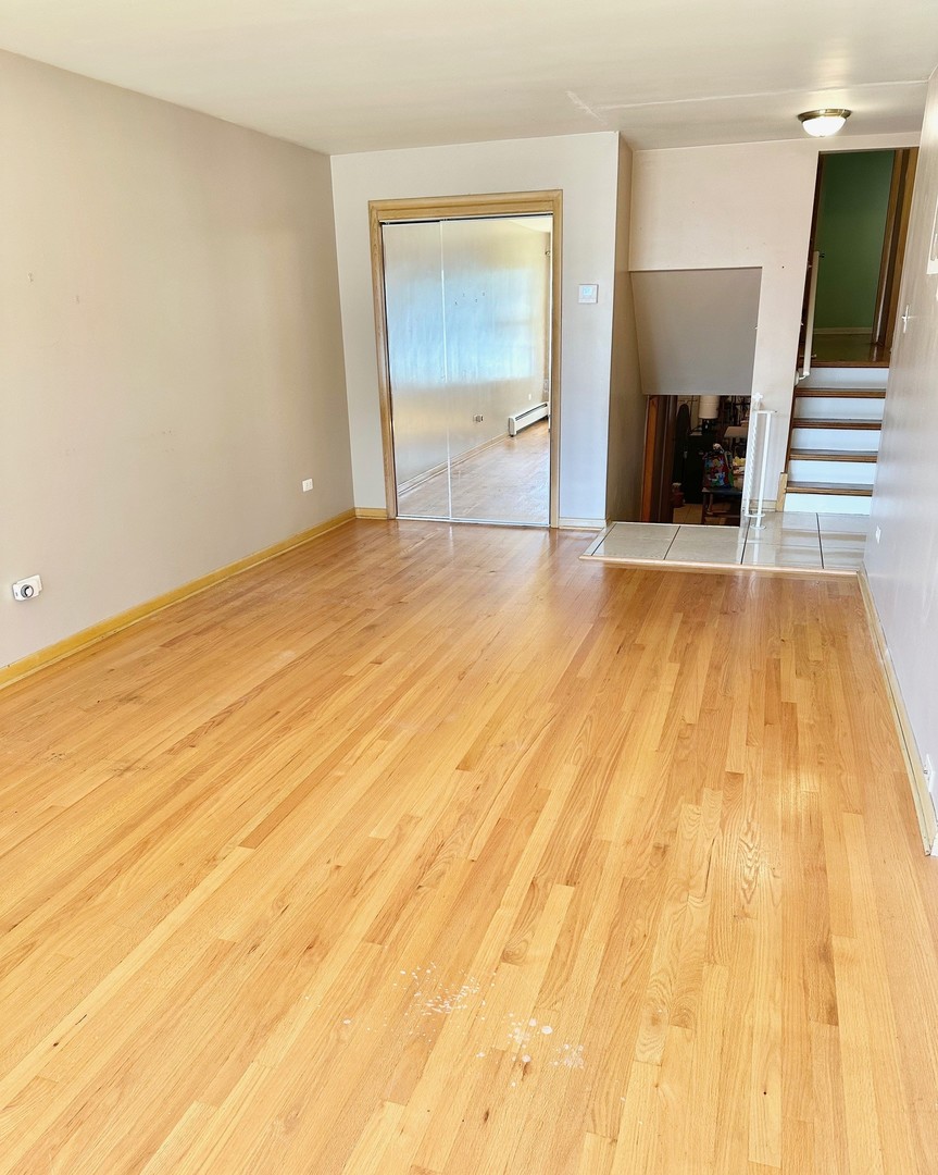 3826 West 83rd Street Chicago, IL 60652 - Photo 3 of 14 a view of empty room with wooden floor