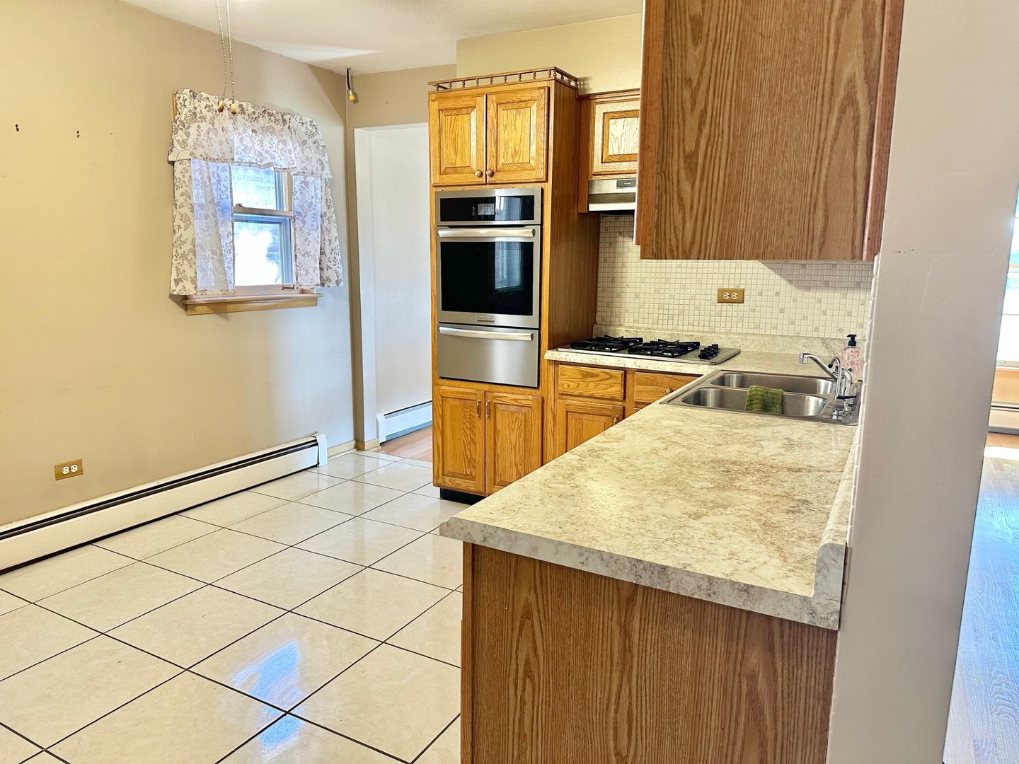 3826 West 83rd Street Chicago, IL 60652 - Photo 5 of 14 a kitchen with a stove a sink and a refrigerator