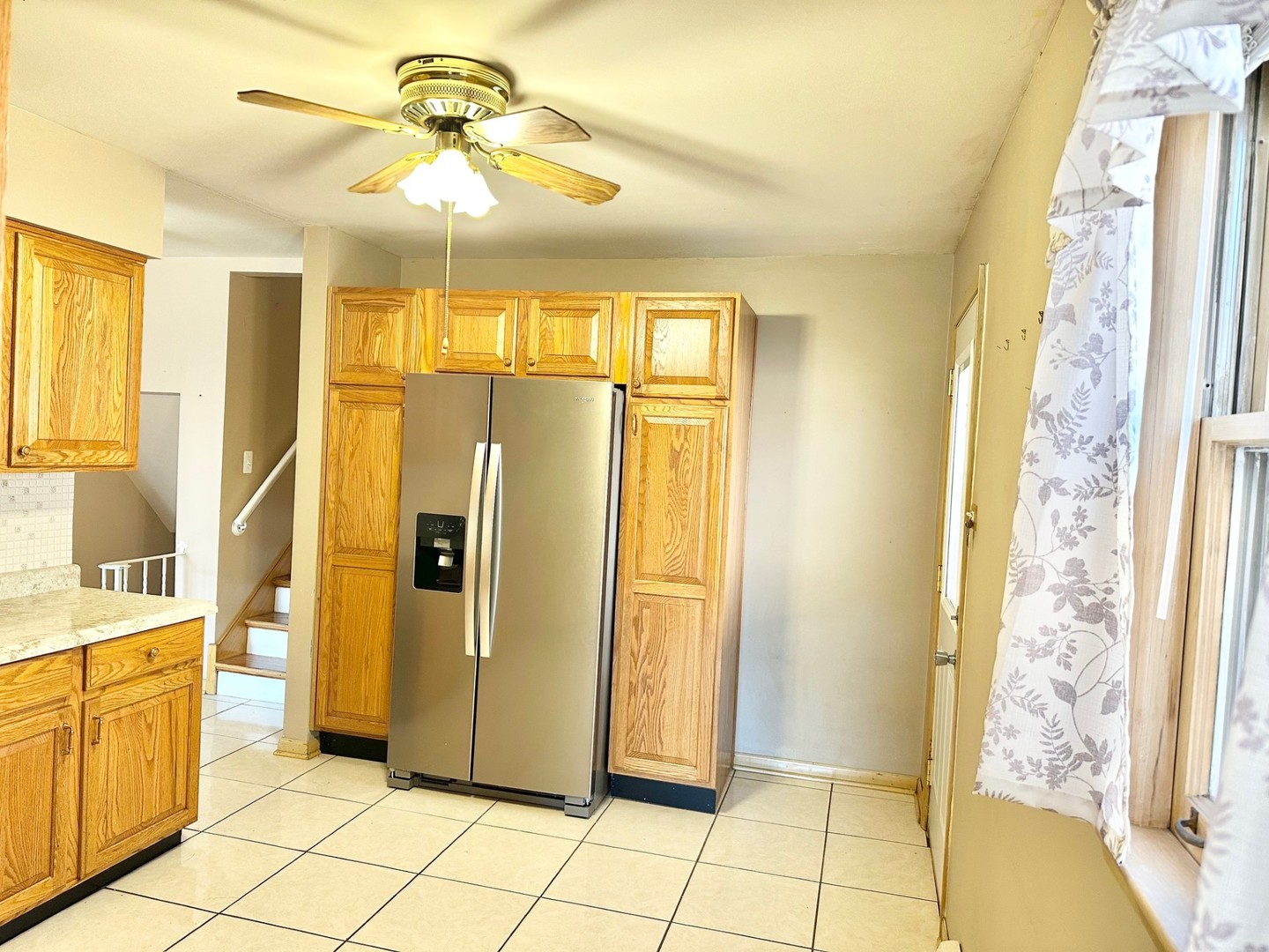 3826 West 83rd Street Chicago, IL 60652 - Photo 6 of 14 a bathroom with a glass shower door and a window