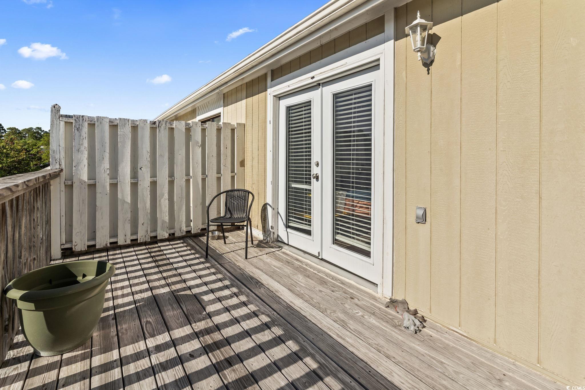 1411 Turkey Ridge Road, Unit 30B Surfside Beach, SC 29575 - Photo 16 of 21 Wooden terrace featuring french doors