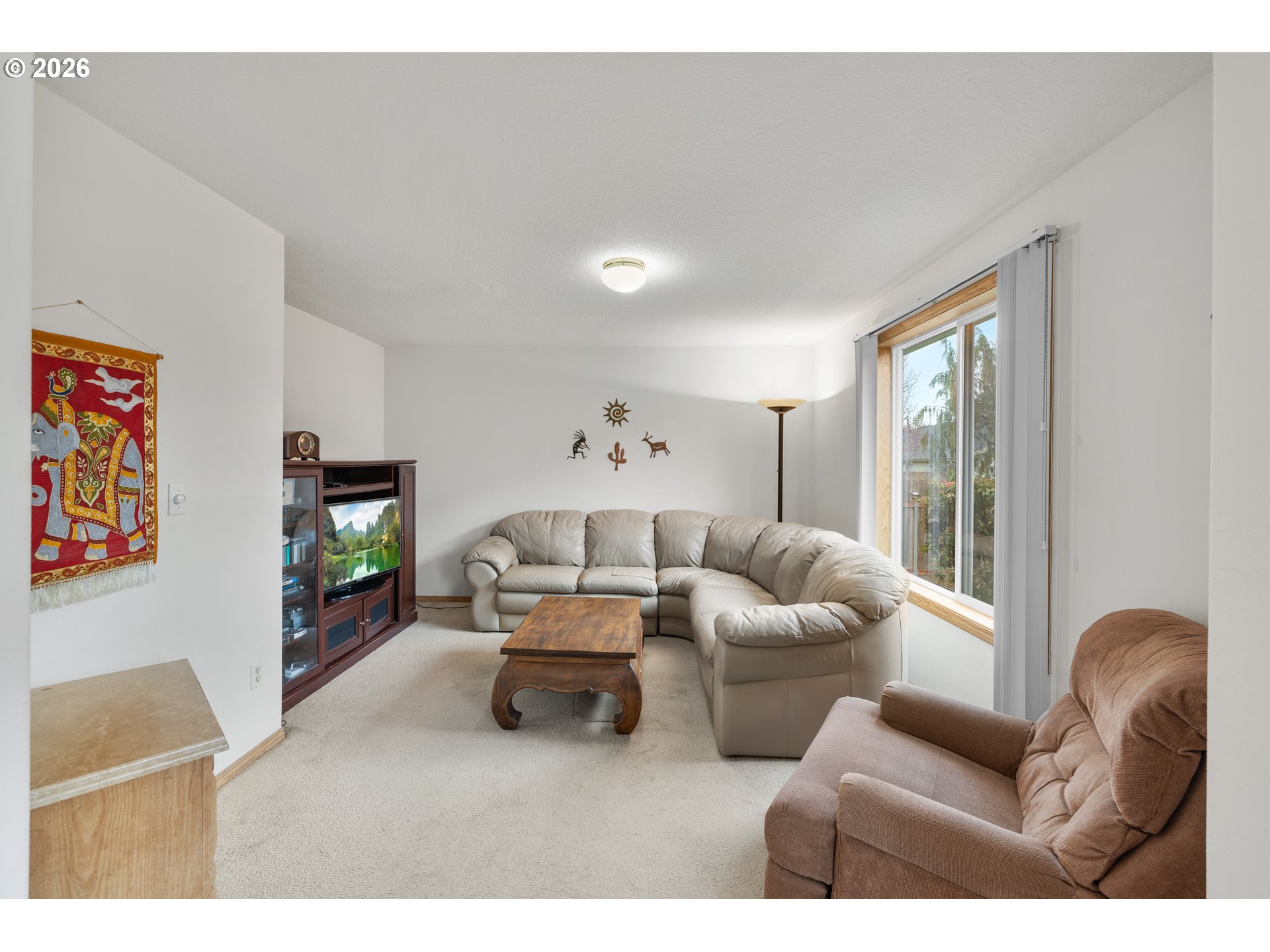 607 Southeast 5th Street Battle Ground, WA 98604 - Photo 14 of 33 a living room with furniture and a flat screen tv