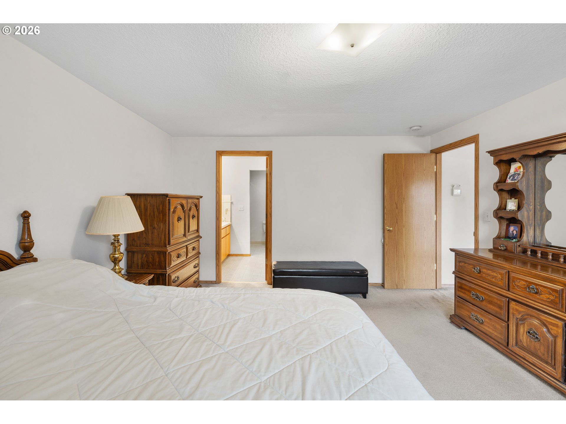 607 Southeast 5th Street Battle Ground, WA 98604 - Photo 17 of 33 a bedroom with a bed and wooden floor