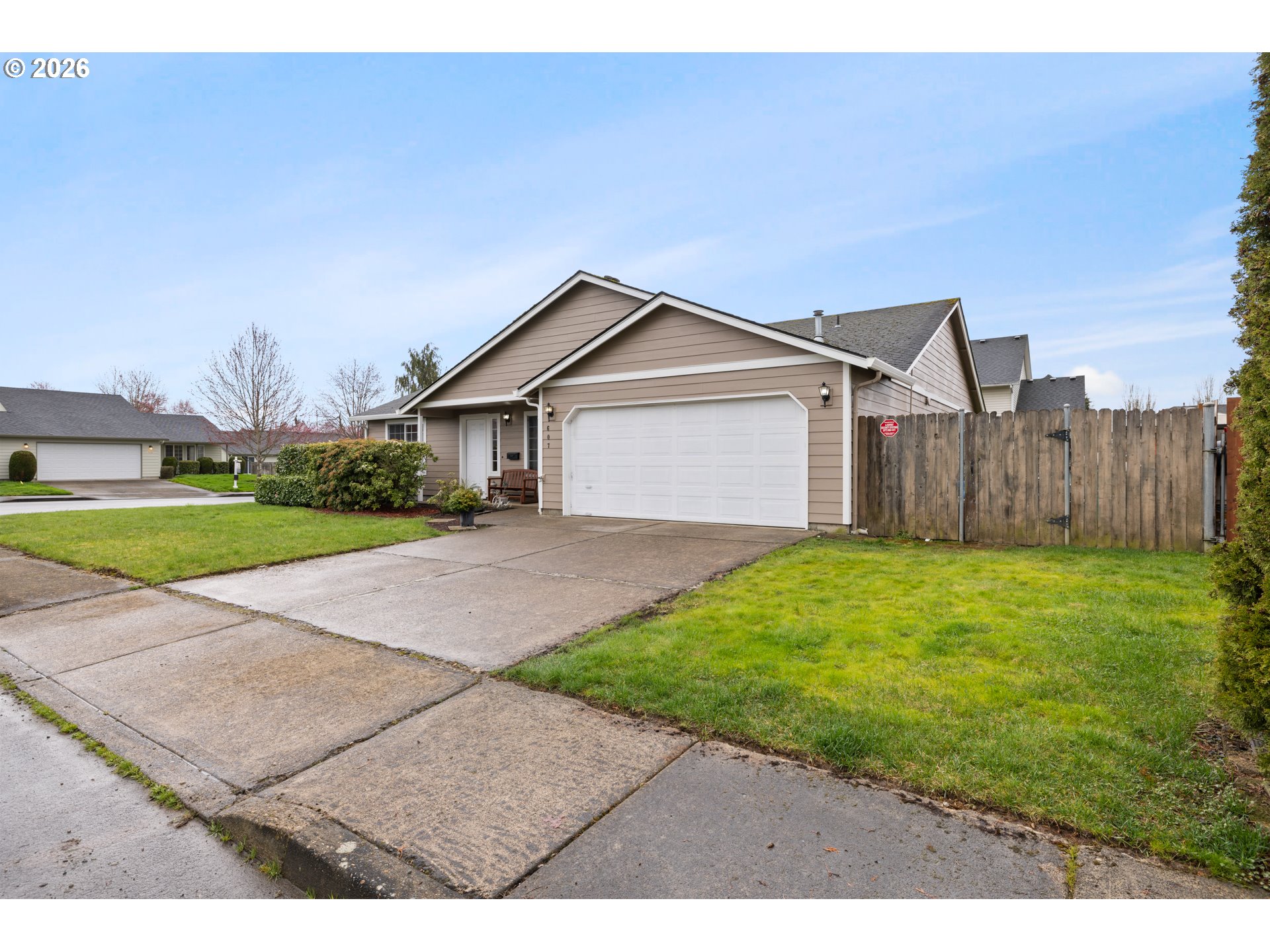 607 Southeast 5th Street Battle Ground, WA 98604 - Photo 2 of 33 a view of a house with a yard and fence