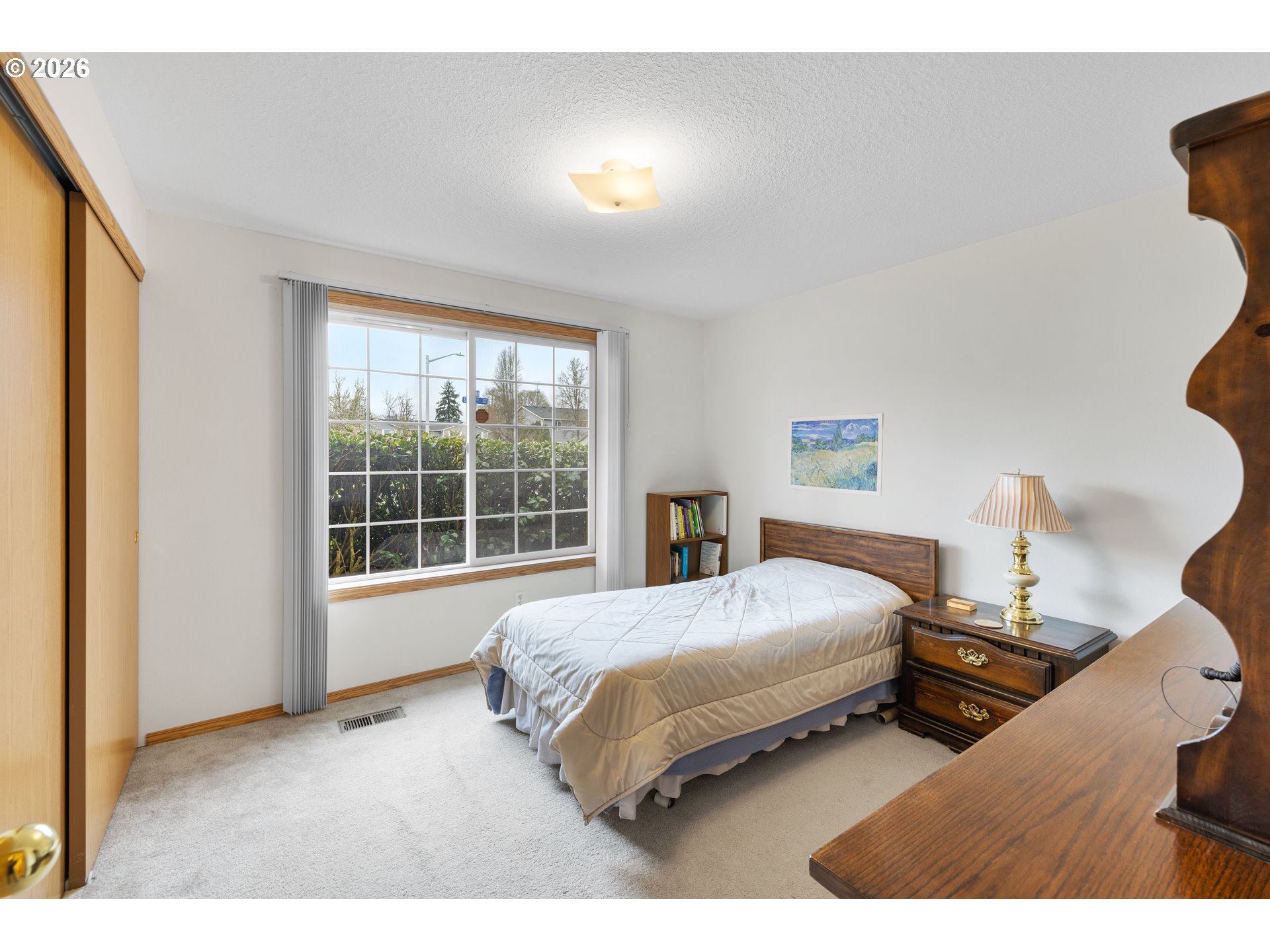 607 Southeast 5th Street Battle Ground, WA 98604 - Photo 21 of 33 a bedroom with a bed and a large window