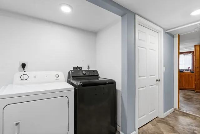 a view of storage and utility room with washer and dryer