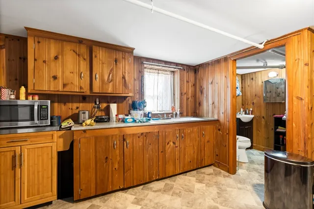 a bathroom with a sink a mirror and a bathtub