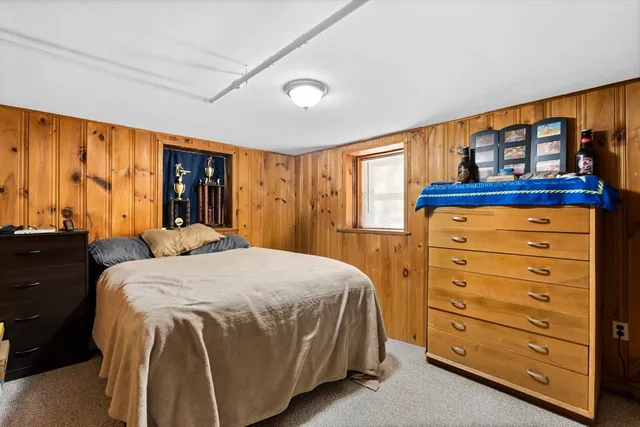 a bed room with a bed and a window