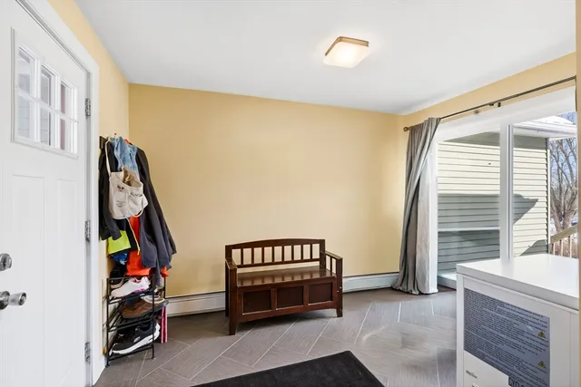 a bedroom with furniture and a window