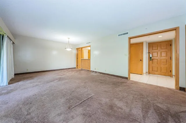 a view of an empty room with a window