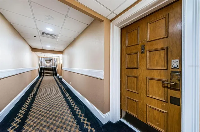 a view of a big yard with large trees