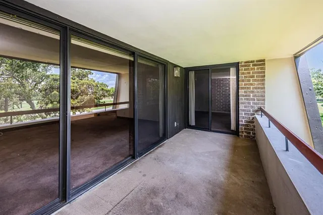 a view of entryway with a floor to ceiling window