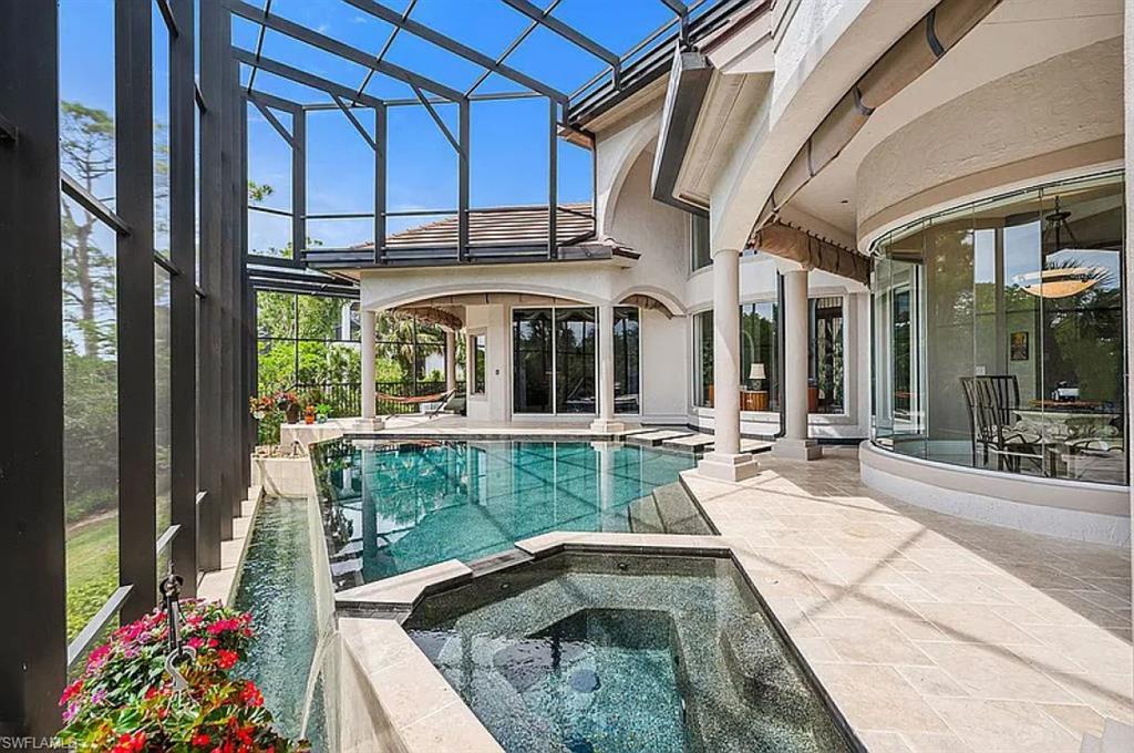 1237 Pocantico Lane Naples, FL 34110 - Photo 12 of 20 a view of swimming pool with outdoor seating