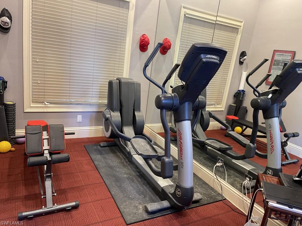 1237 Pocantico Lane Naples, FL 34110 - Photo 19 of 20 a view of a room with gym equipment