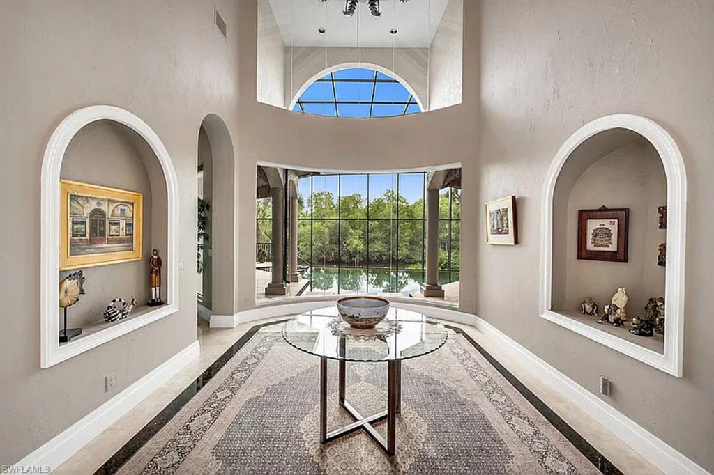 1237 Pocantico Lane Naples, FL 34110 - Photo 2 of 20 a living room with furniture and a window