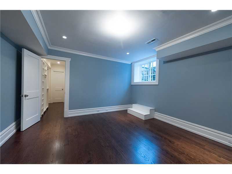 63 Winthrop Drive Riverside, CT 06878 - Photo 21 of 25 a view of an empty room with wooden floor and a window