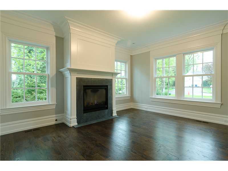 63 Winthrop Drive Riverside, CT 06878 - Photo 3 of 25 a view of empty room with wooden floor and fireplace