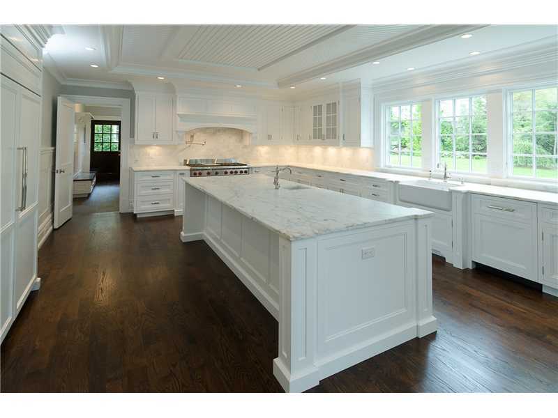 63 Winthrop Drive Riverside, CT 06878 - Photo 5 of 25 a kitchen with counter top space sink and refrigerator