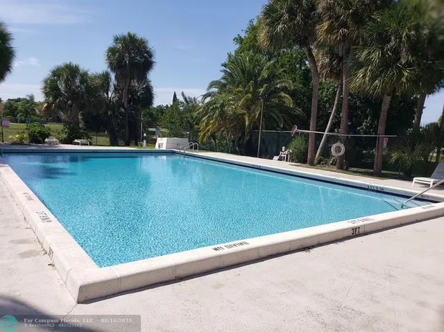 a view of swimming pool with a yard